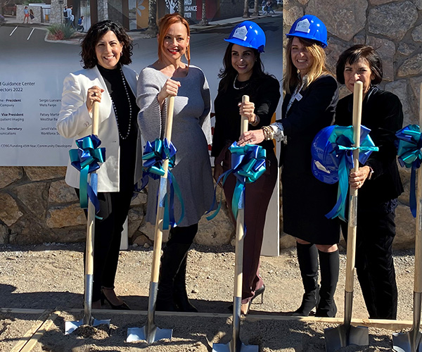 women at groundbreaking with shovels
